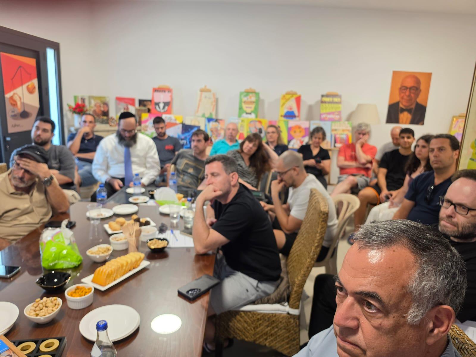 The hub hall filled to capacity, with the founder in the foreground